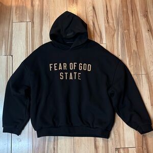 Fear of God Black Hoodie with Gold Lettering